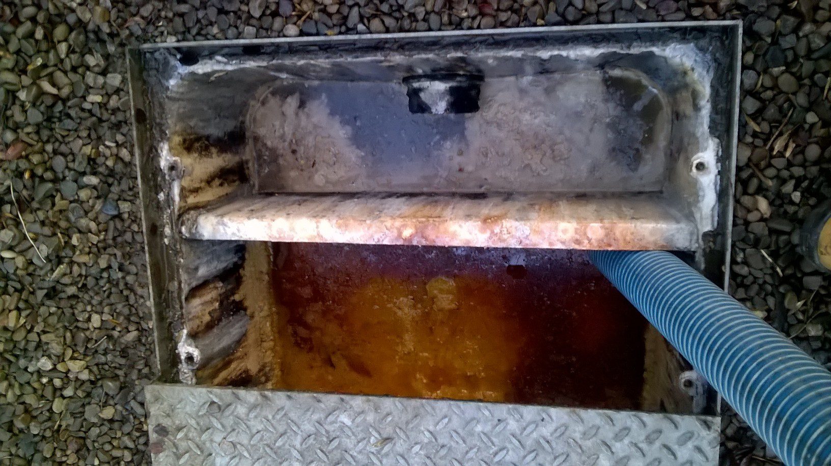 grease trap being pumped out